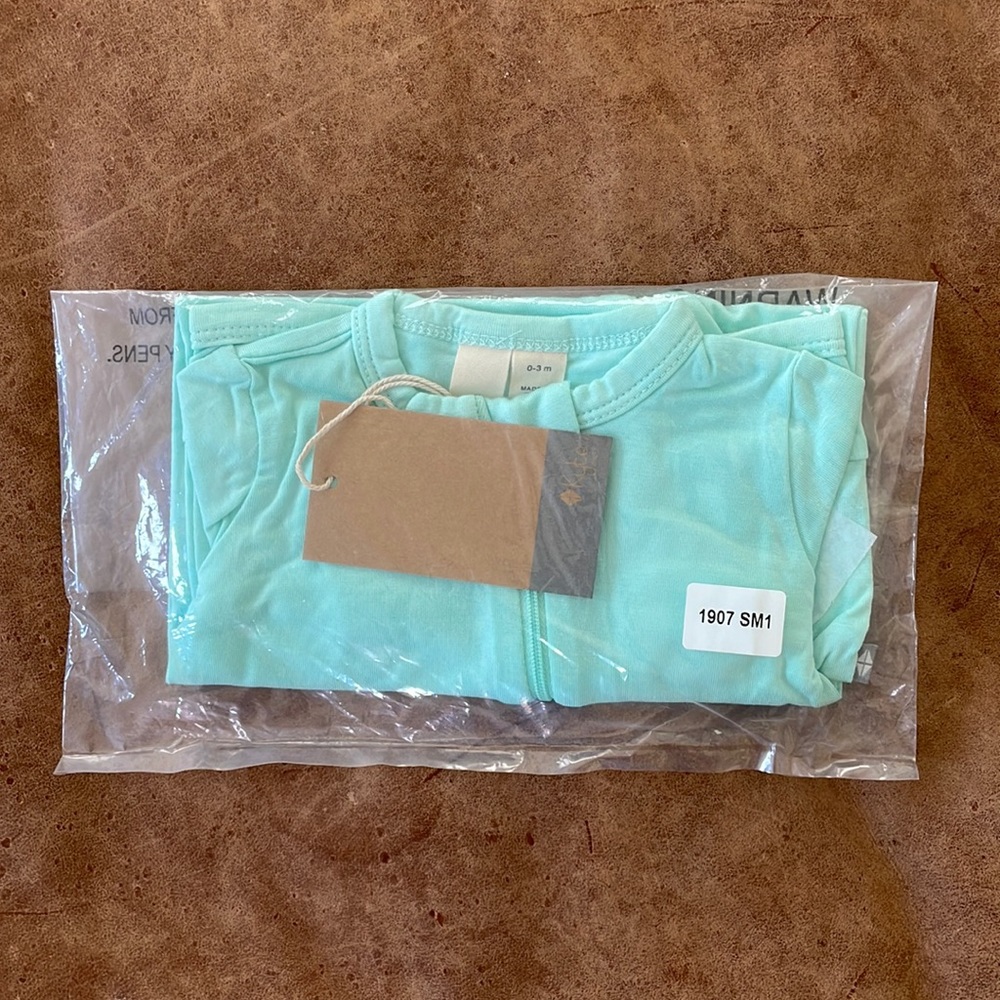Kyte baby long sleeve zip romper in sea mist
